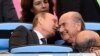 Brazil -- Russian President Vladimir Putin (L) speaks to FIFA President Sepp Blatter during the 2014 World Cup final between Germany and Argentina at the Maracana stadium in Rio de Janeiro July 13, 2014.